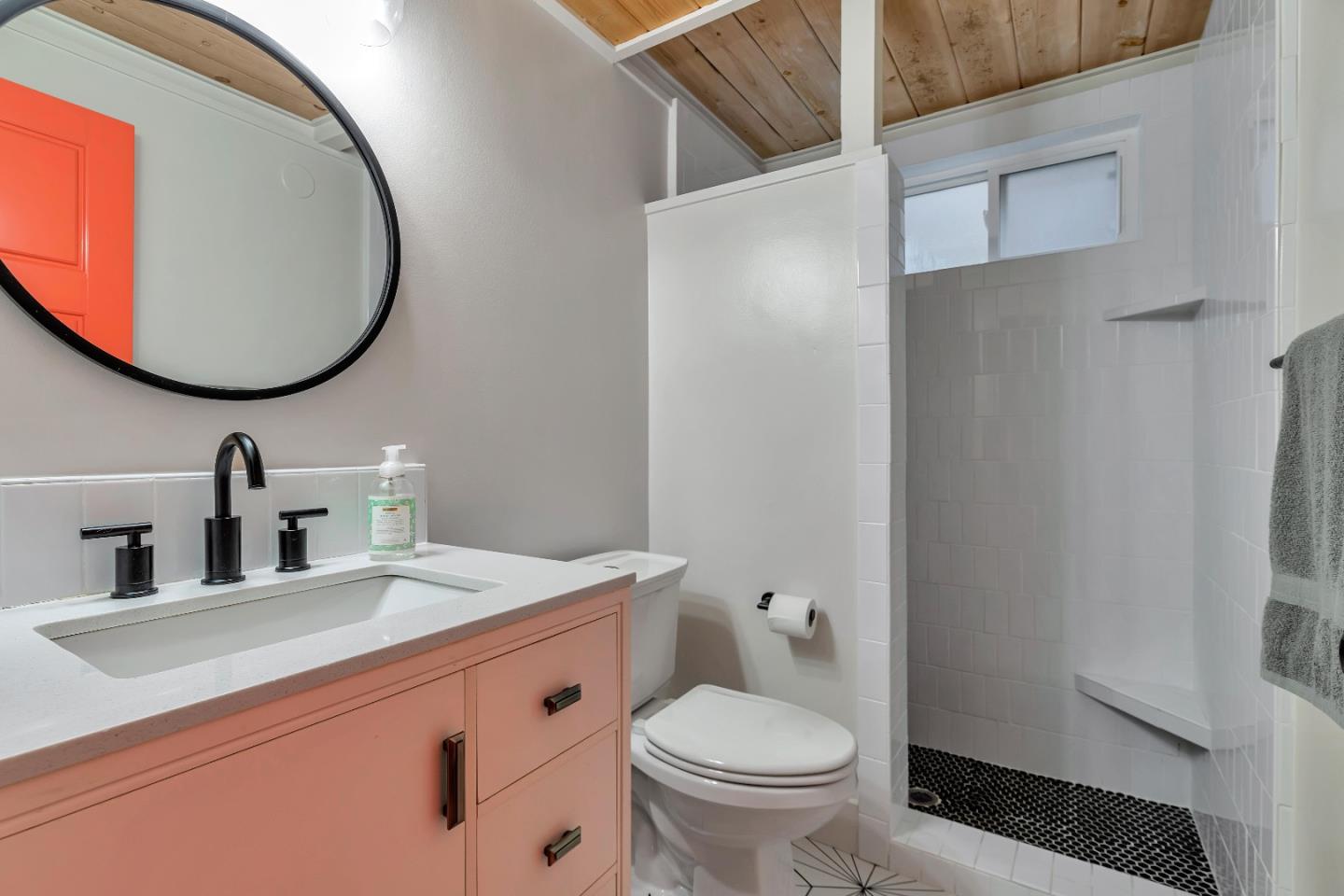 225 Treasure Island Drive Aptos, CA 95003 - Photo 16 of 63 a bathroom with a sink and a mirror