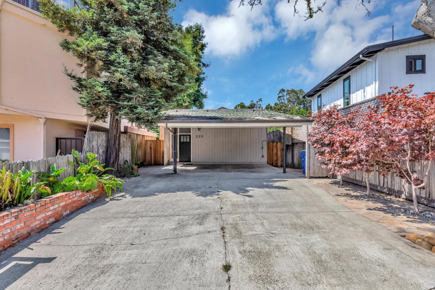 225 Treasure Island Drive Aptos, CA 95003 - Photo 2 of 63 a front view of a house with a yard and a garage
