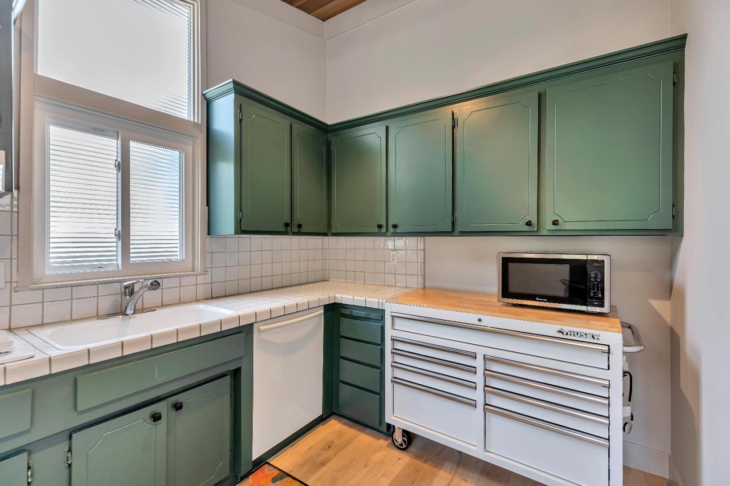 225 Treasure Island Drive Aptos, CA 95003 - Photo 23 of 63 a kitchen with a sink cabinets and microwave