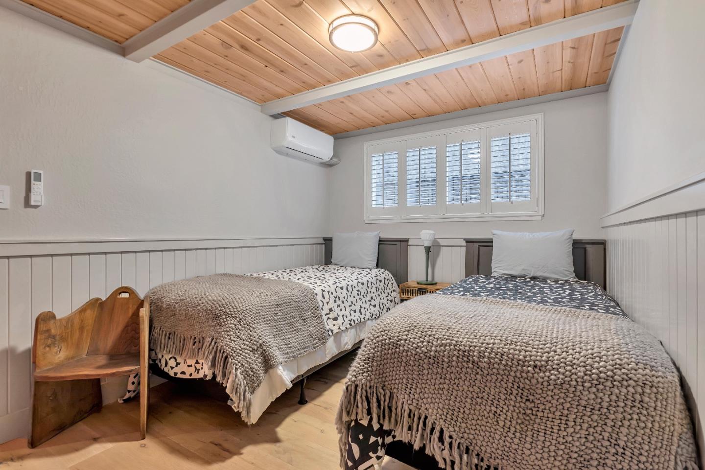 225 Treasure Island Drive Aptos, CA 95003 - Photo 27 of 63 a bedroom with two beds and a chair