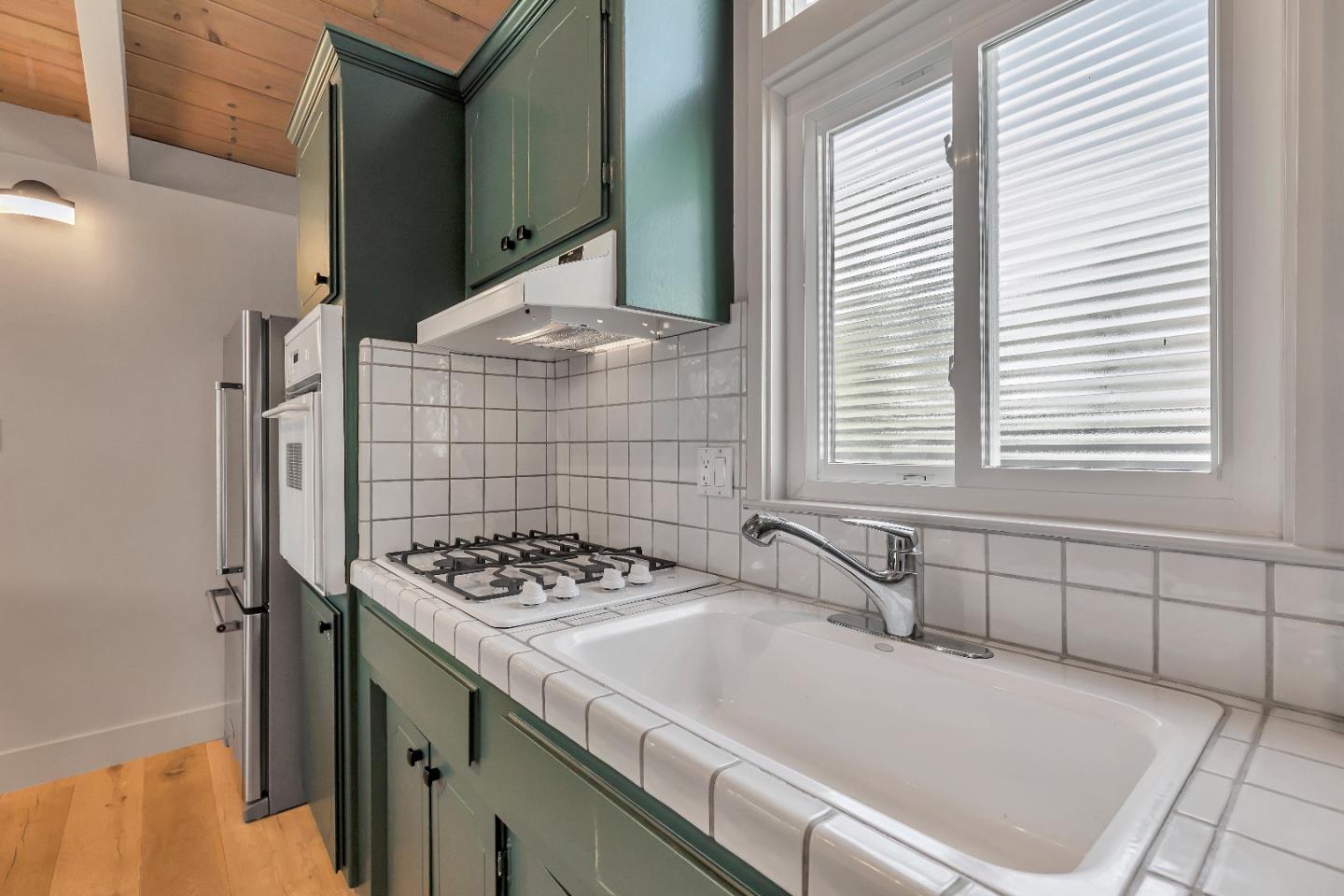 225 Treasure Island Drive Aptos, CA 95003 - Photo 30 of 63 a bathroom with a sink a toilet and a shower