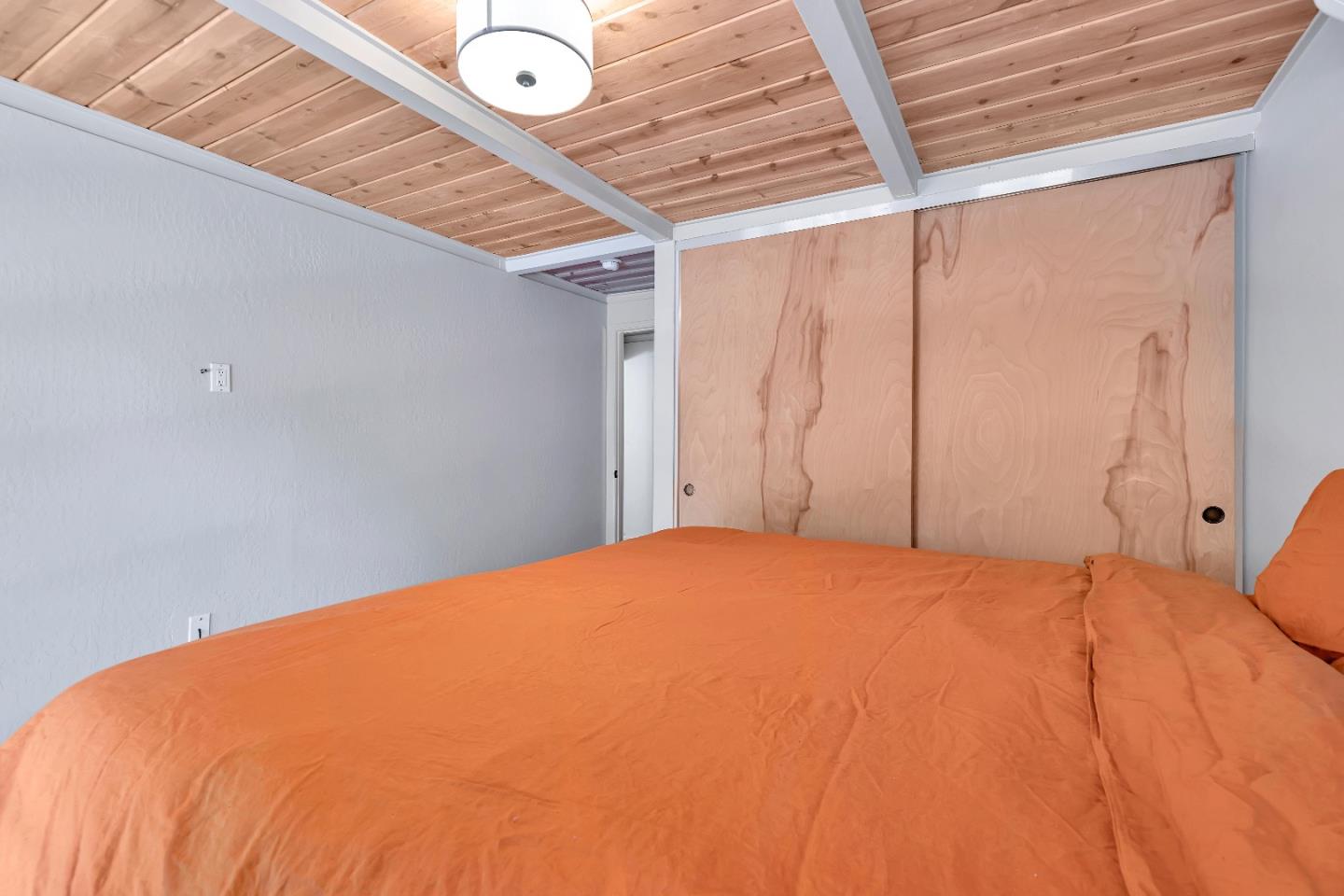 225 Treasure Island Drive Aptos, CA 95003 - Photo 38 of 63 a bedroom with a bed and a window