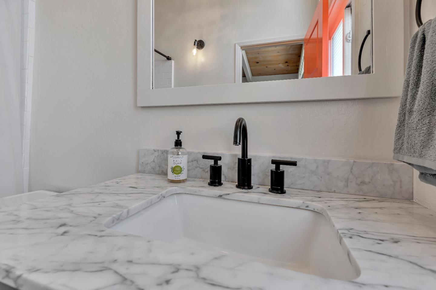 225 Treasure Island Drive Aptos, CA 95003 - Photo 56 of 63 a bathroom with a sink and vanity