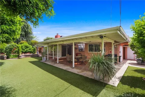 a view of a house with a yard porch and sitting area