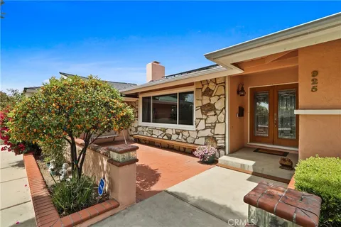 a view of house with patio outdoor seating