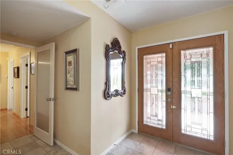 a view of an entryway with wooden floor