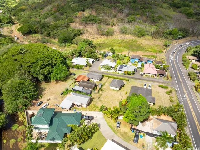an aerial view of residential houses with outdoor space