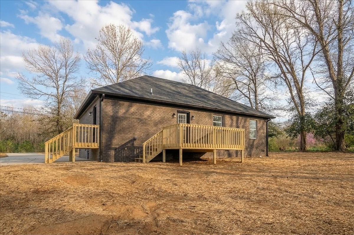 3987 Buffalo Road Summertown, TN 38483 - Photo 4 of 26 a front view of a house with a yard