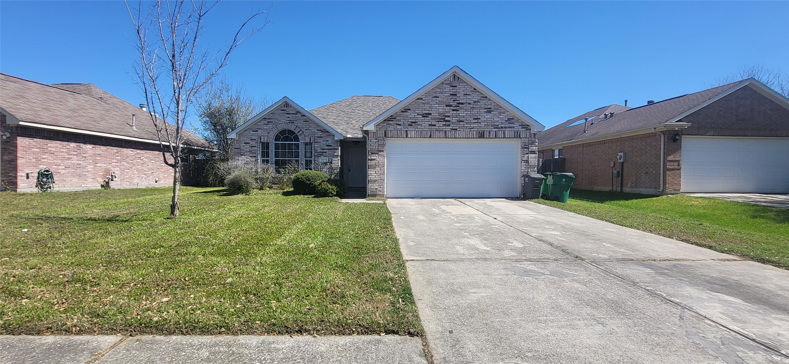 24022 Rockygate Drive Spring, TX 77373 - Photo 1 of 12 front view of a house with a yard