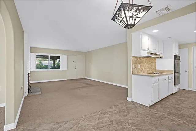 a view of an empty room and window