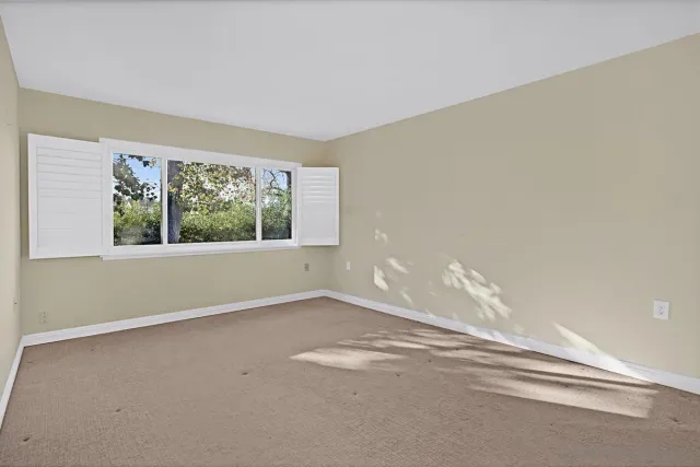 a view of a room that has a window in it