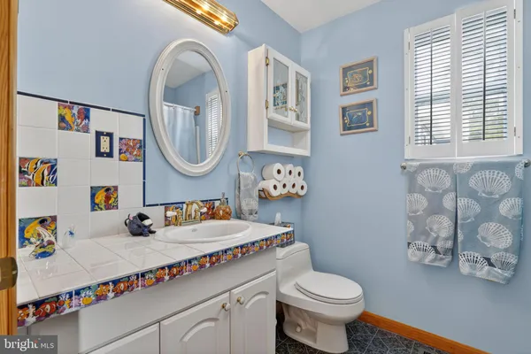 a view of closet with wooden floor