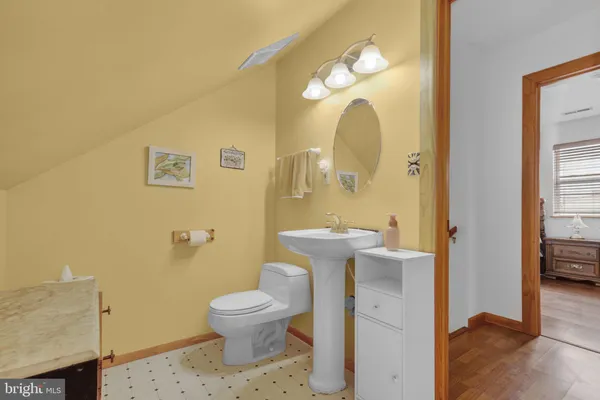 a view of room with furniture and wooden floor