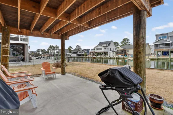 a view of a house with outdoor space and lake view