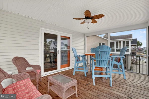 a living room with furniture a wooden floor and a window