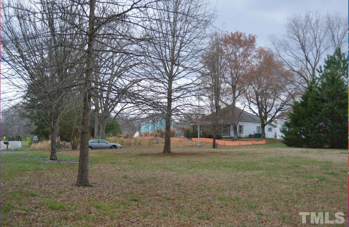 901 Homestead Road Chapel Hill, NC 27516 - Photo 1 of 28 a view of a tree in the middle of a yard