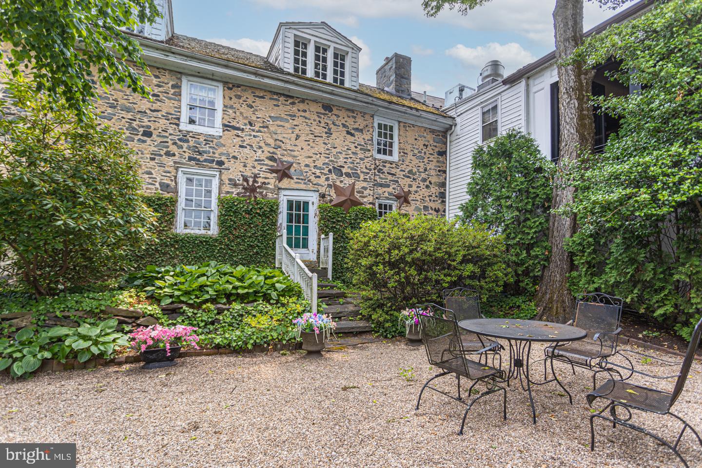 4 West Mechanic Street New Hope, PA 18938 - Photo 28 of 36 a view of a patio with table and chairs and potted plants