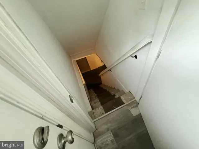 a view of an empty room and wooden floor