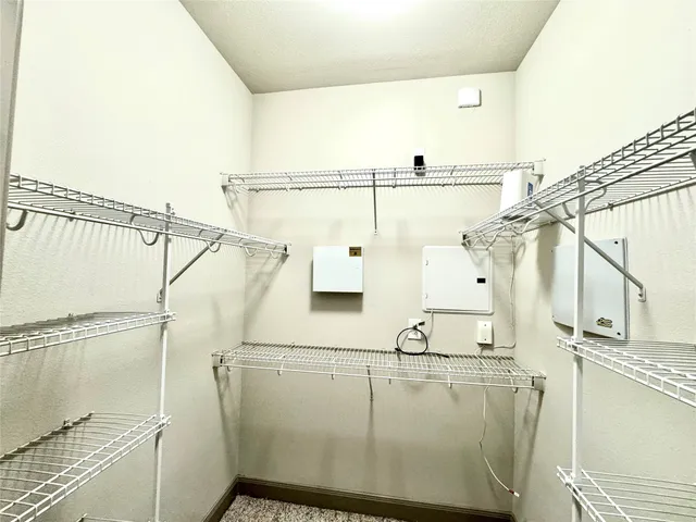 a view of a balcony with wooden floor and floor to ceiling window