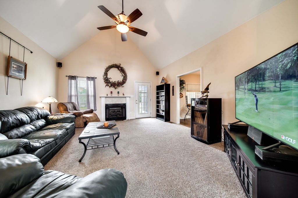 1918 Victorian Road Columbia, TN 38401 - Photo 8 of 47 a living room with furniture a fireplace and a ceiling fan