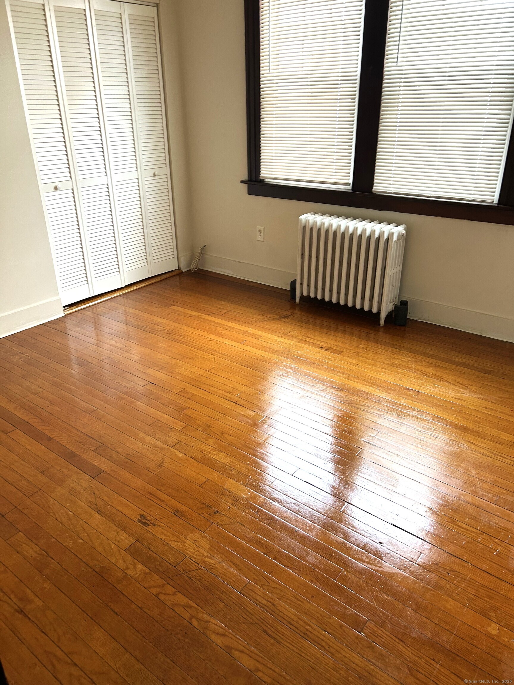 104 Howard Avenue New Haven, CT 06519 - Photo 7 of 9 a view of room with window and wooden floor