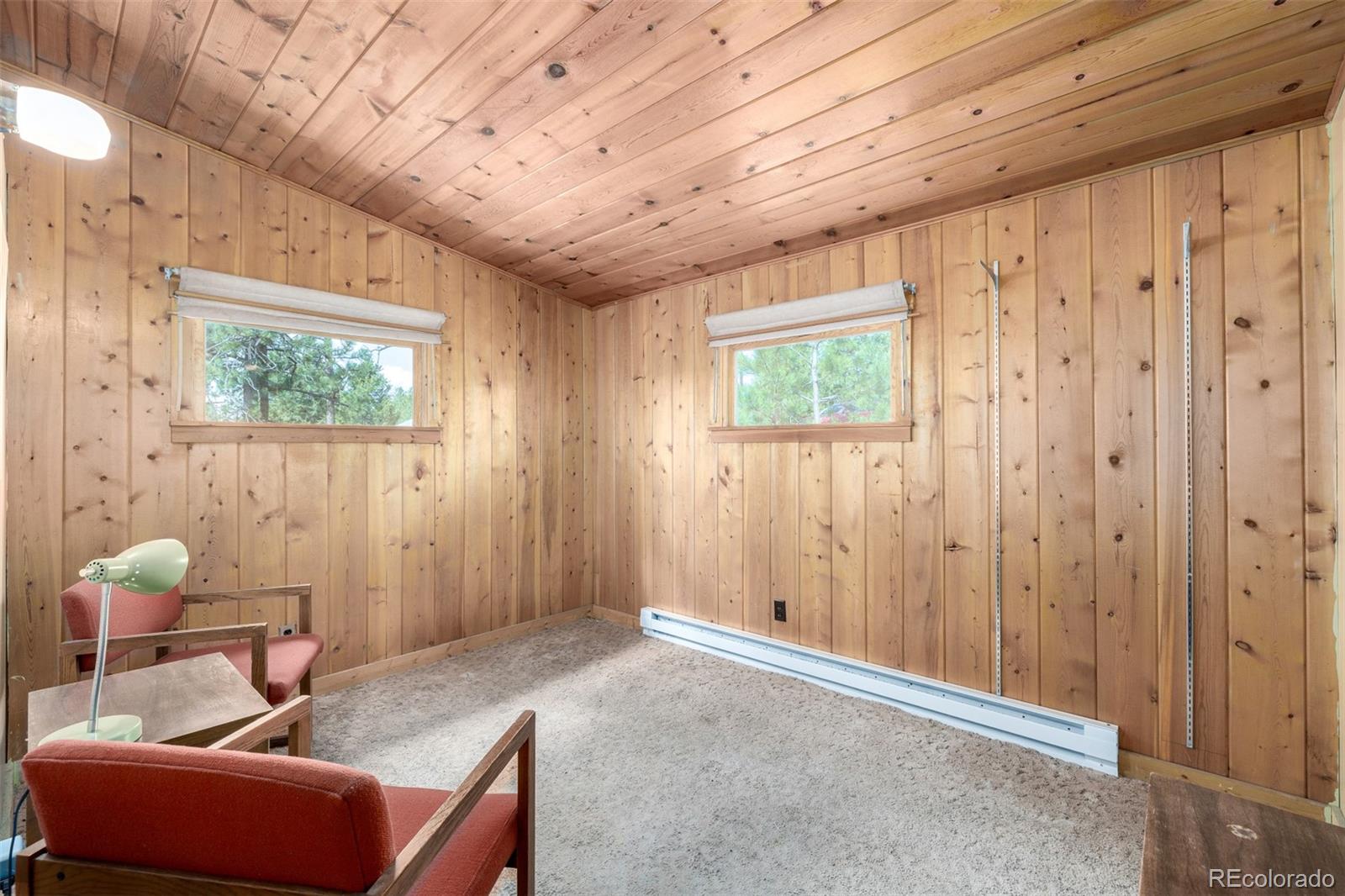 7105 Flagstaff Road Boulder, CO 80302 - Photo 14 of 45 a living room with furniture and a window
