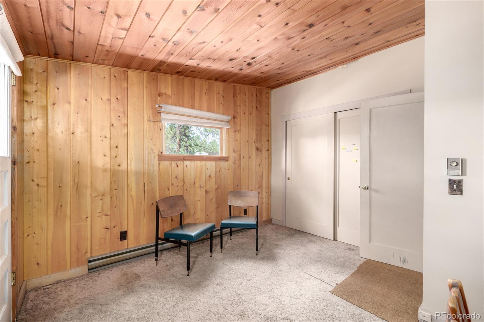 7105 Flagstaff Road Boulder, CO 80302 - Photo 17 of 45 a living room with furniture and a window