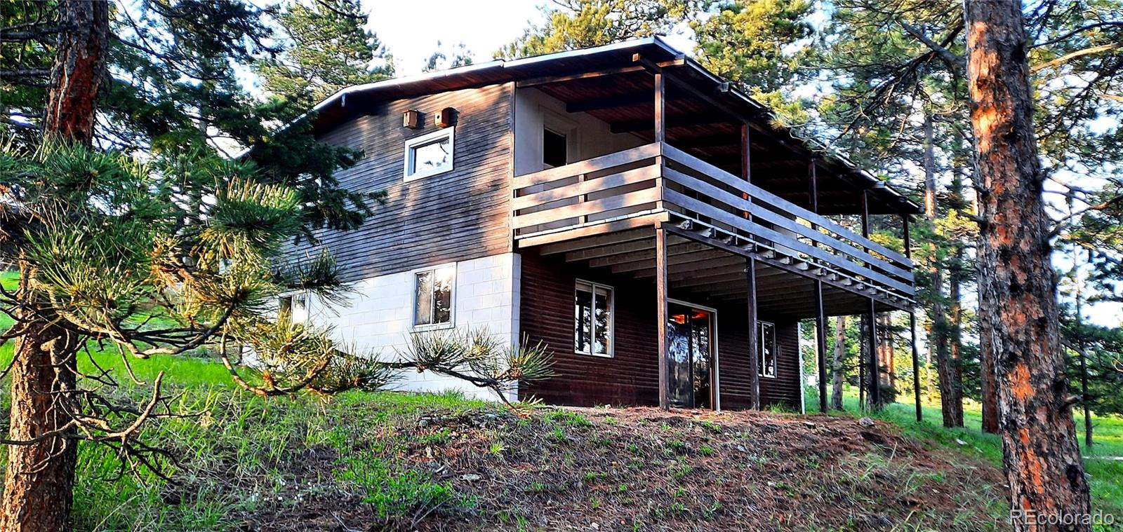 7105 Flagstaff Road Boulder, CO 80302 - Photo 29 of 45 a front view of a house with garden