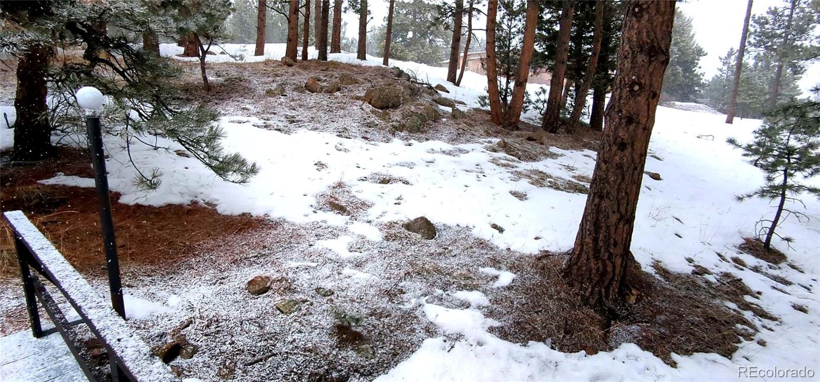 7105 Flagstaff Road Boulder, CO 80302 - Photo 44 of 45 a view of a yard covered in snow