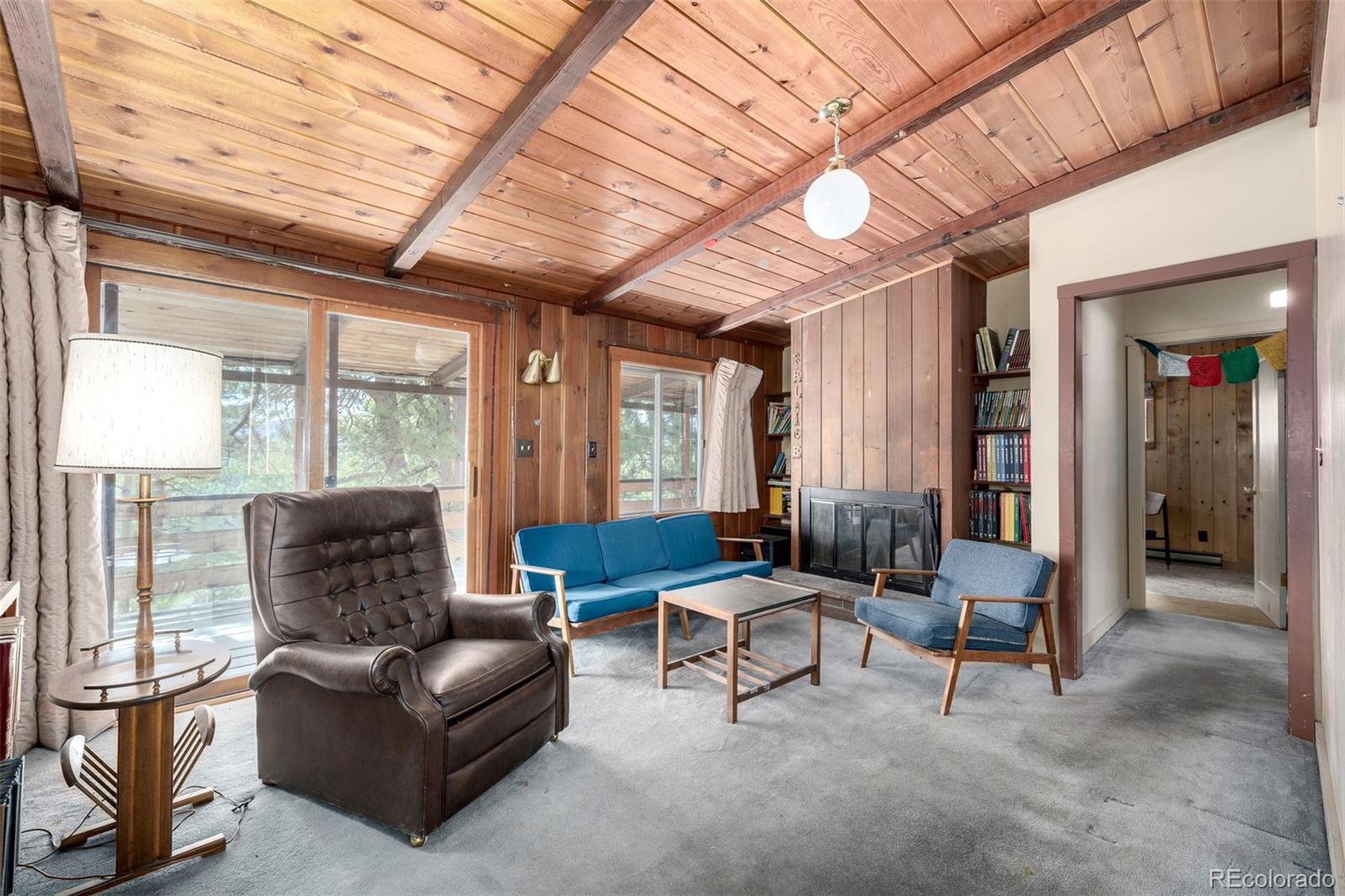 7105 Flagstaff Road Boulder, CO 80302 - Photo 7 of 45 a living room with furniture and a large window
