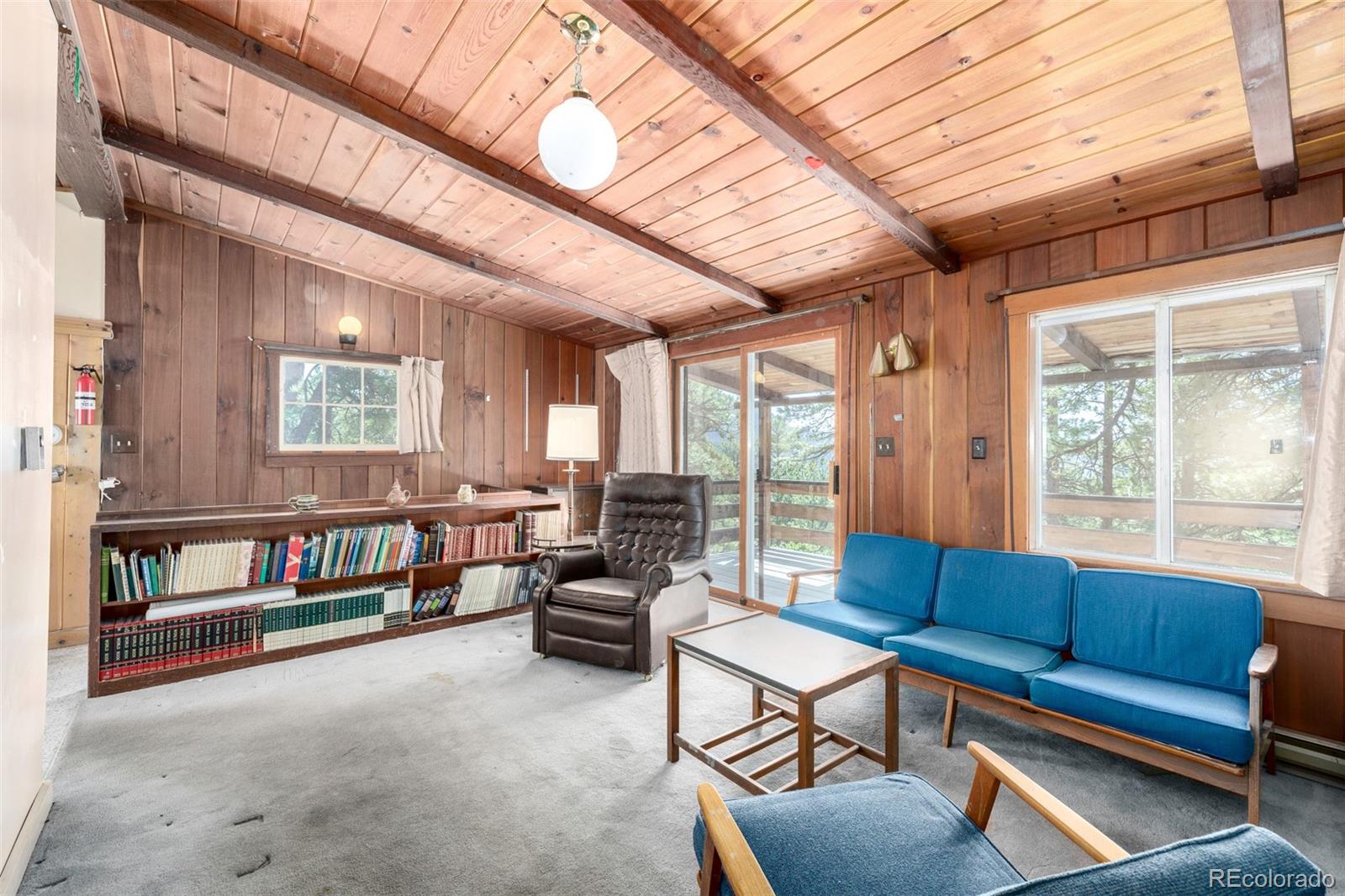 7105 Flagstaff Road Boulder, CO 80302 - Photo 8 of 45 a living room with furniture and a large window