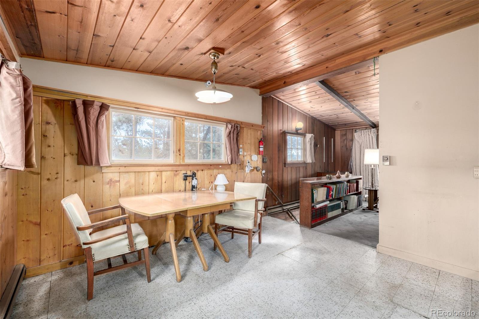 7105 Flagstaff Road Boulder, CO 80302 - Photo 10 of 45 a dining room with furniture and a large window