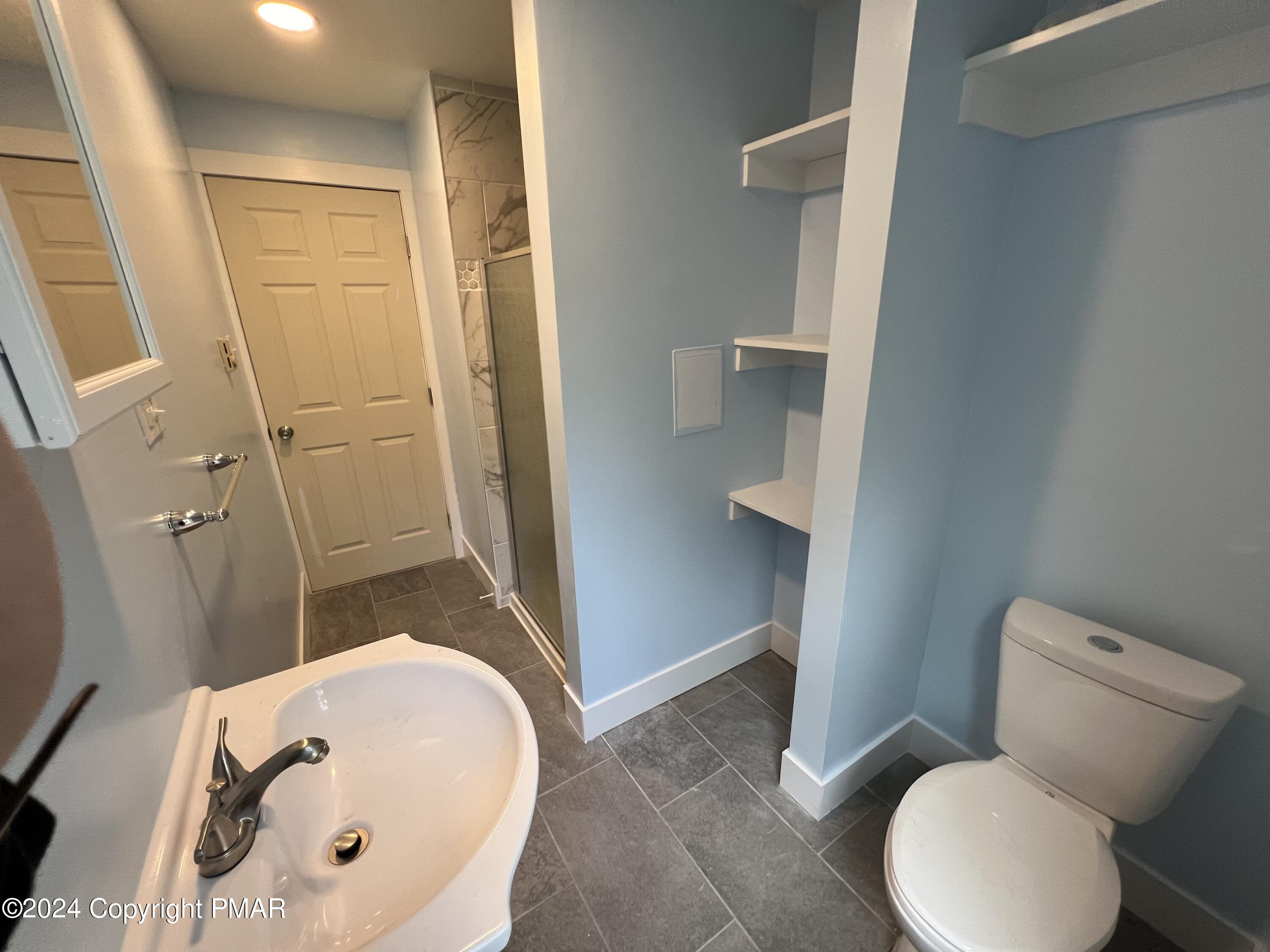 514 Fairground Road Gilbert, PA 18331 - Photo 15 of 20 a bathroom with a sink and toilet