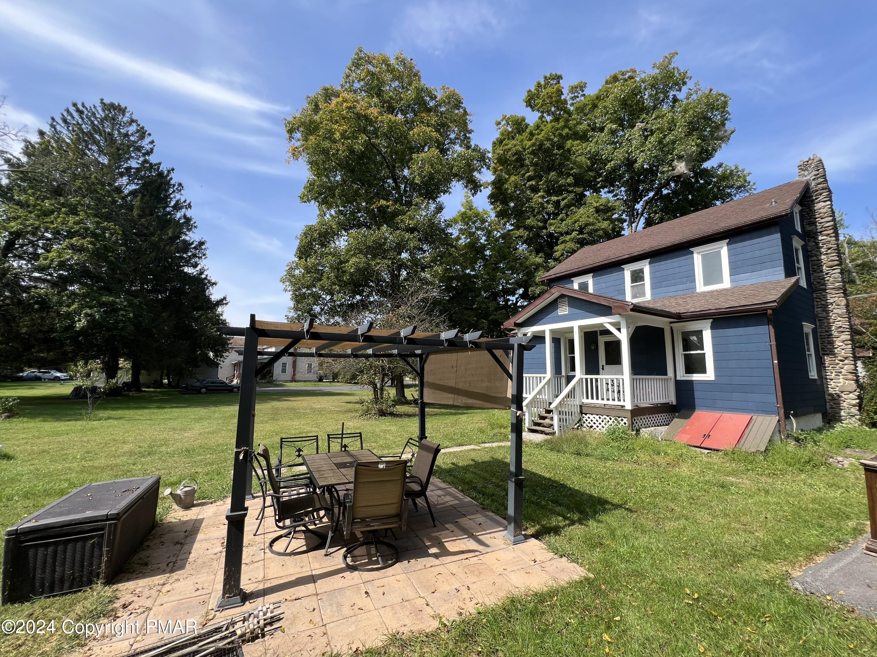 514 Fairground Road Gilbert, PA 18331 - Photo 20 of 20 a view of a house with backyard sitting area and garden