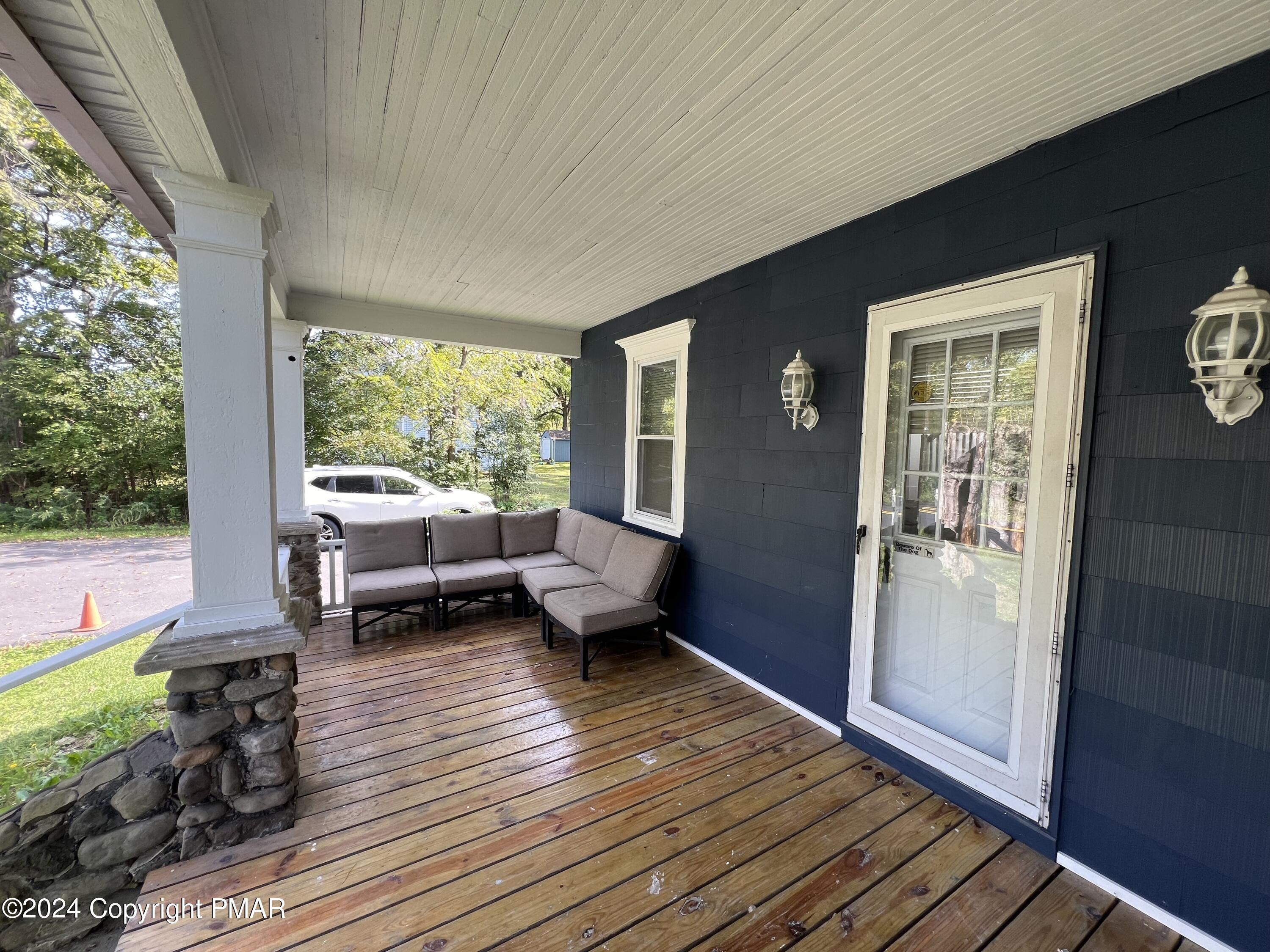 514 Fairground Road Gilbert, PA 18331 - Photo 3 of 20 a living room with furniture and a large window