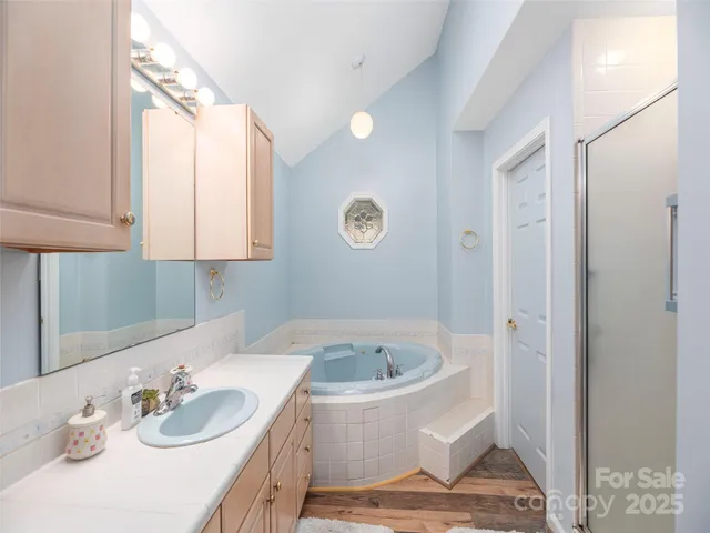 a view of a dining room with furniture and a chandelier