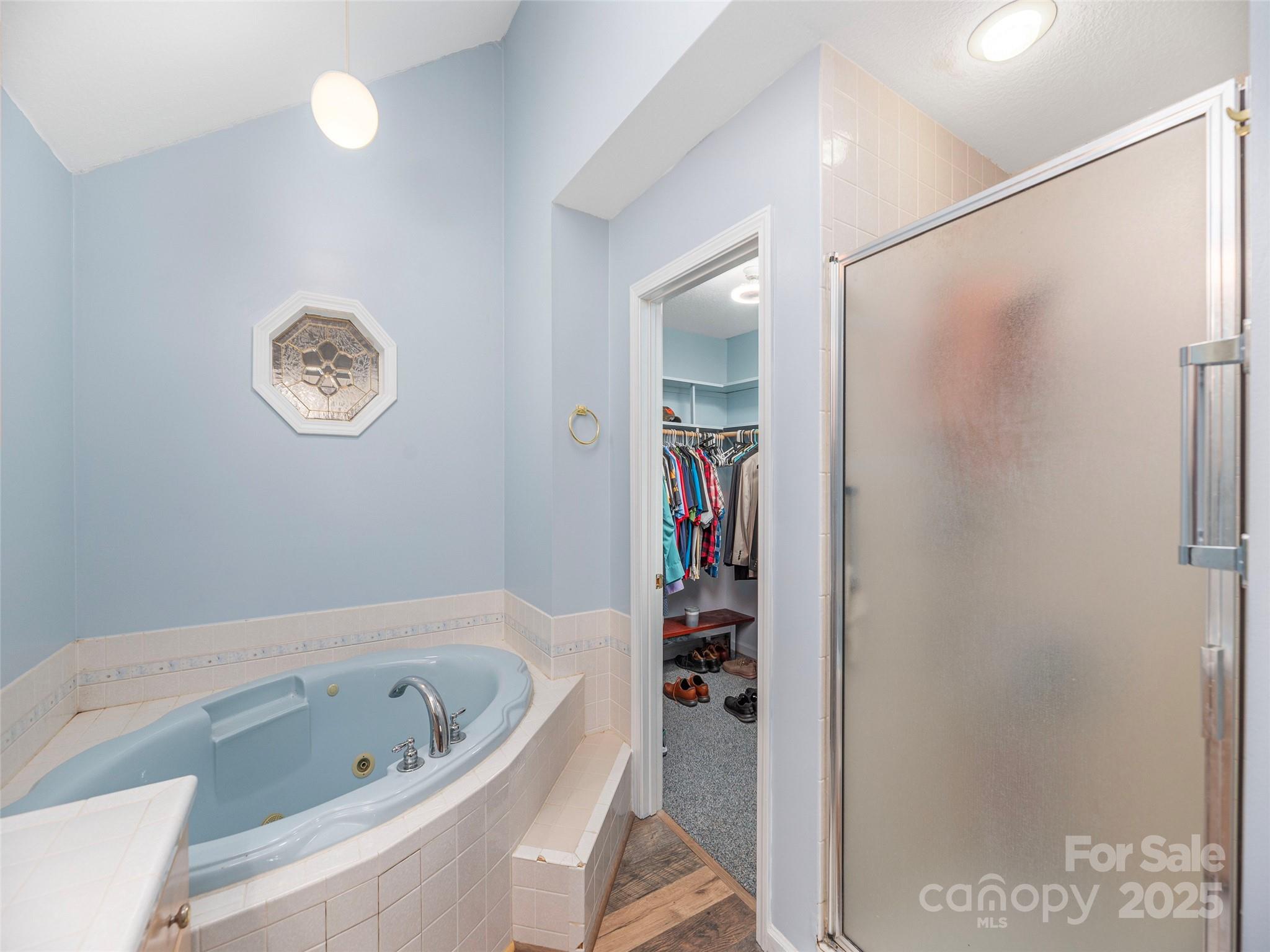 187 Turtle Creek Road Sylva, NC 28779 - Photo 16 of 36 a bathroom with a bathtub and a shower