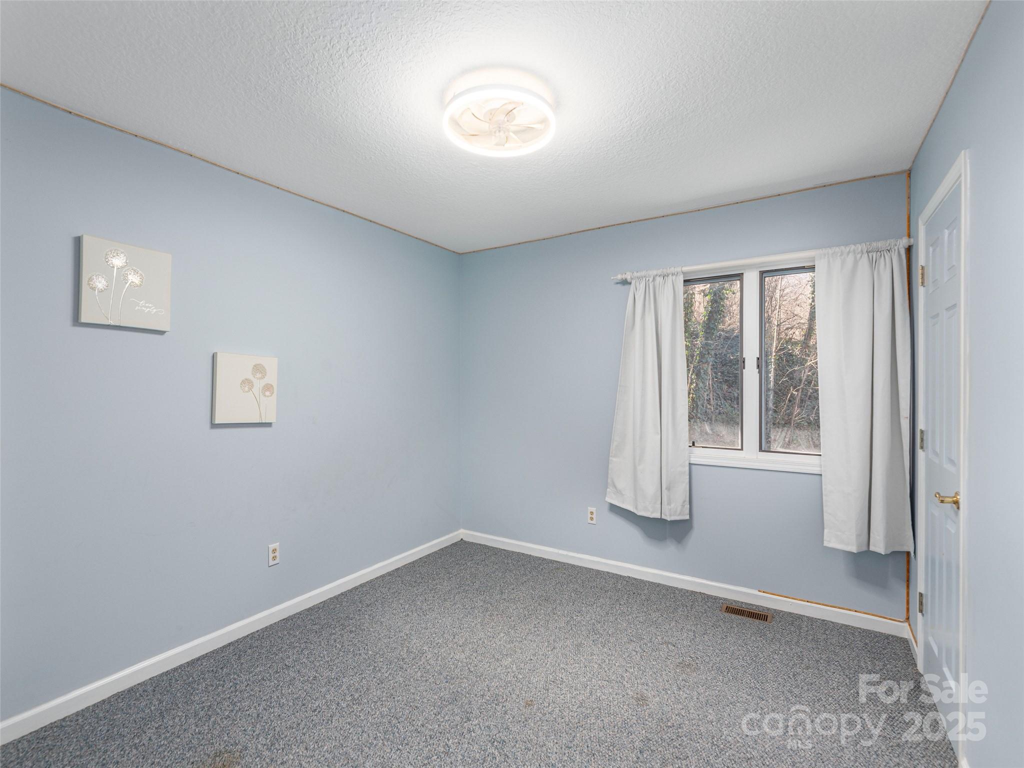 187 Turtle Creek Road Sylva, NC 28779 - Photo 17 of 36 an empty room with a window