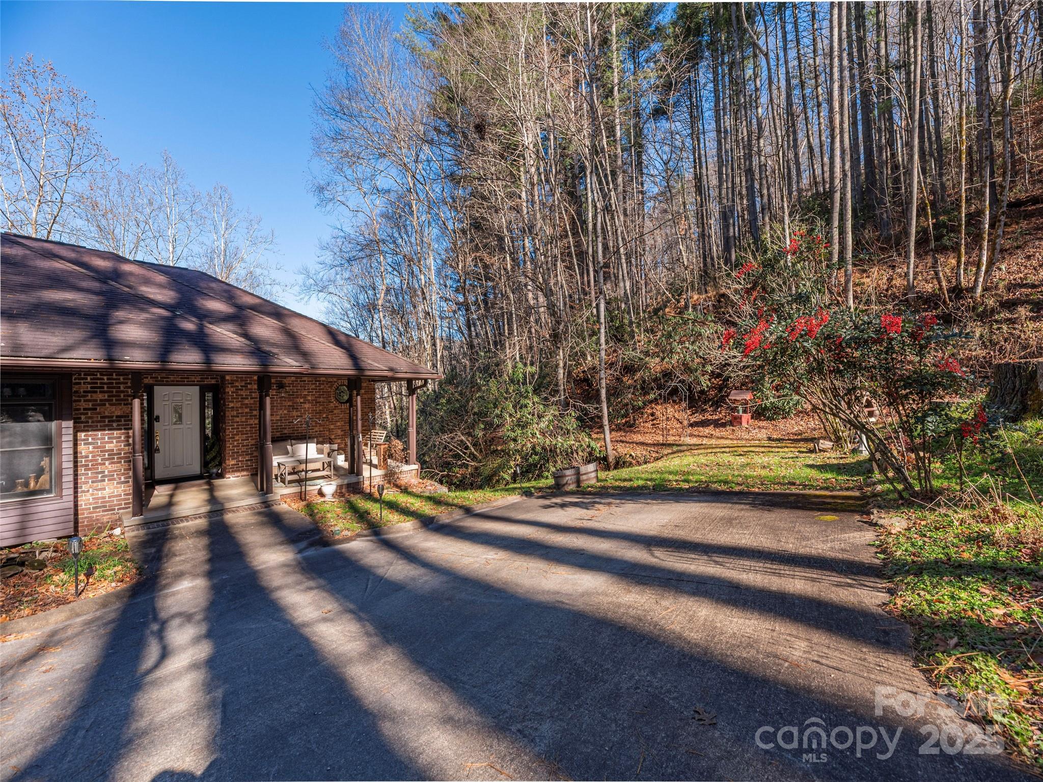 187 Turtle Creek Road Sylva, NC 28779 - Photo 2 of 36 a view of a house with sitting area and tree s