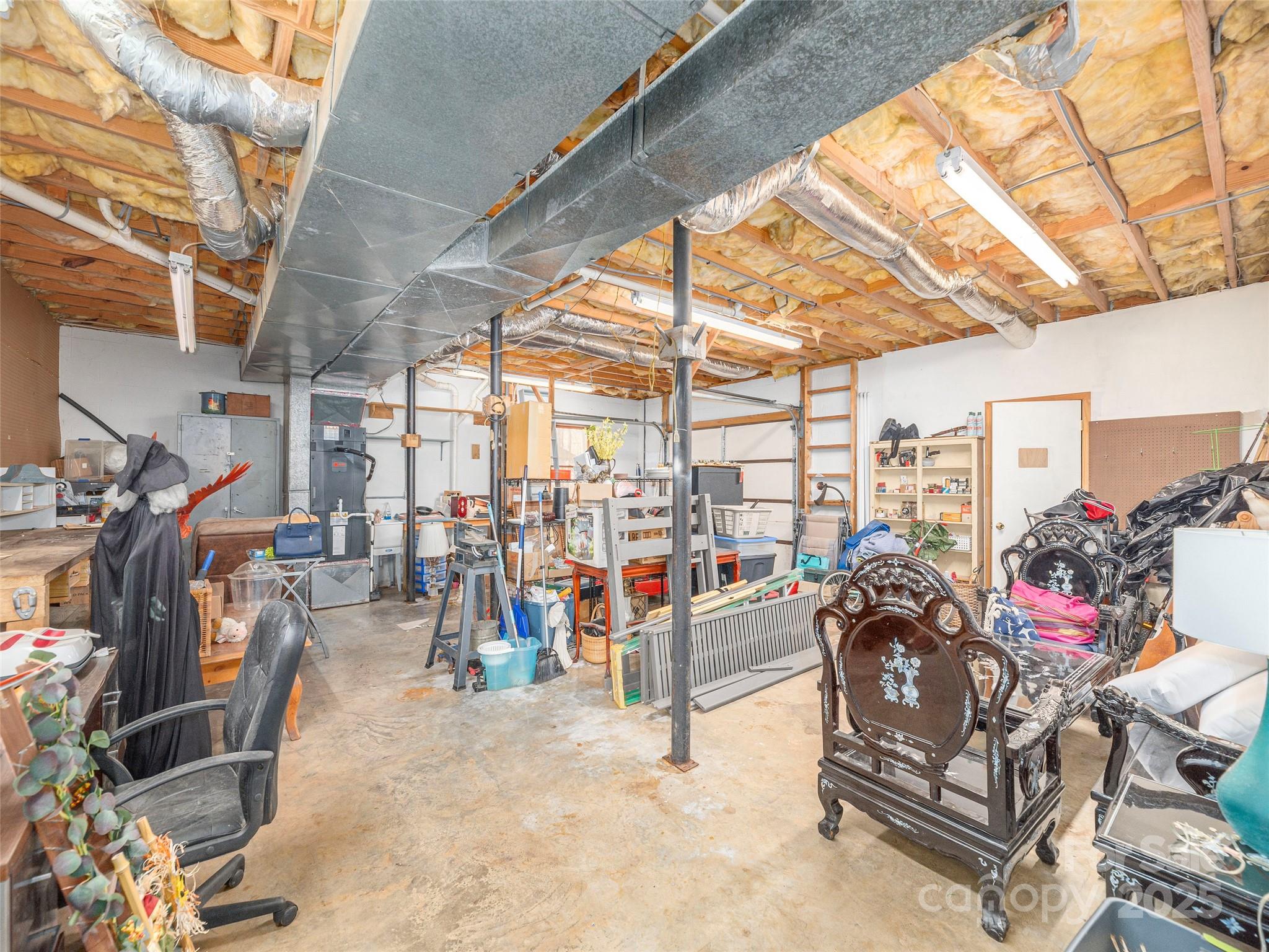 187 Turtle Creek Road Sylva, NC 28779 - Photo 21 of 36 a view of a garage with furniture