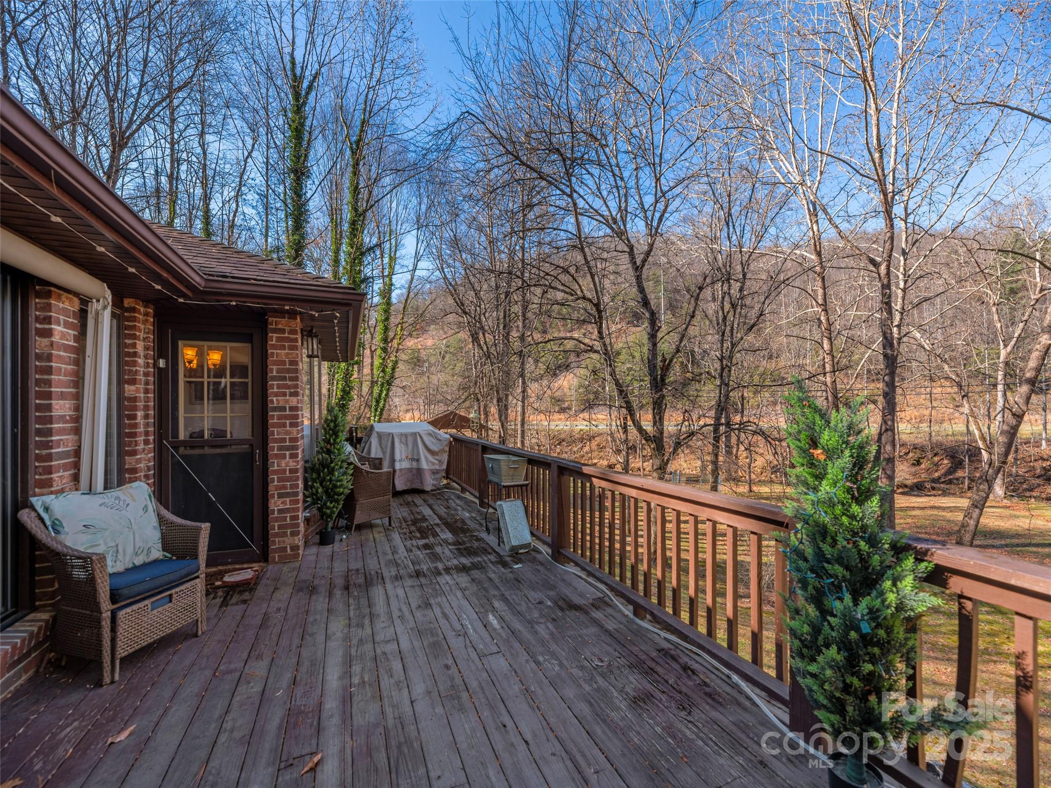 187 Turtle Creek Road Sylva, NC 28779 - Photo 25 of 36 a view of a house with backyard and sitting area
