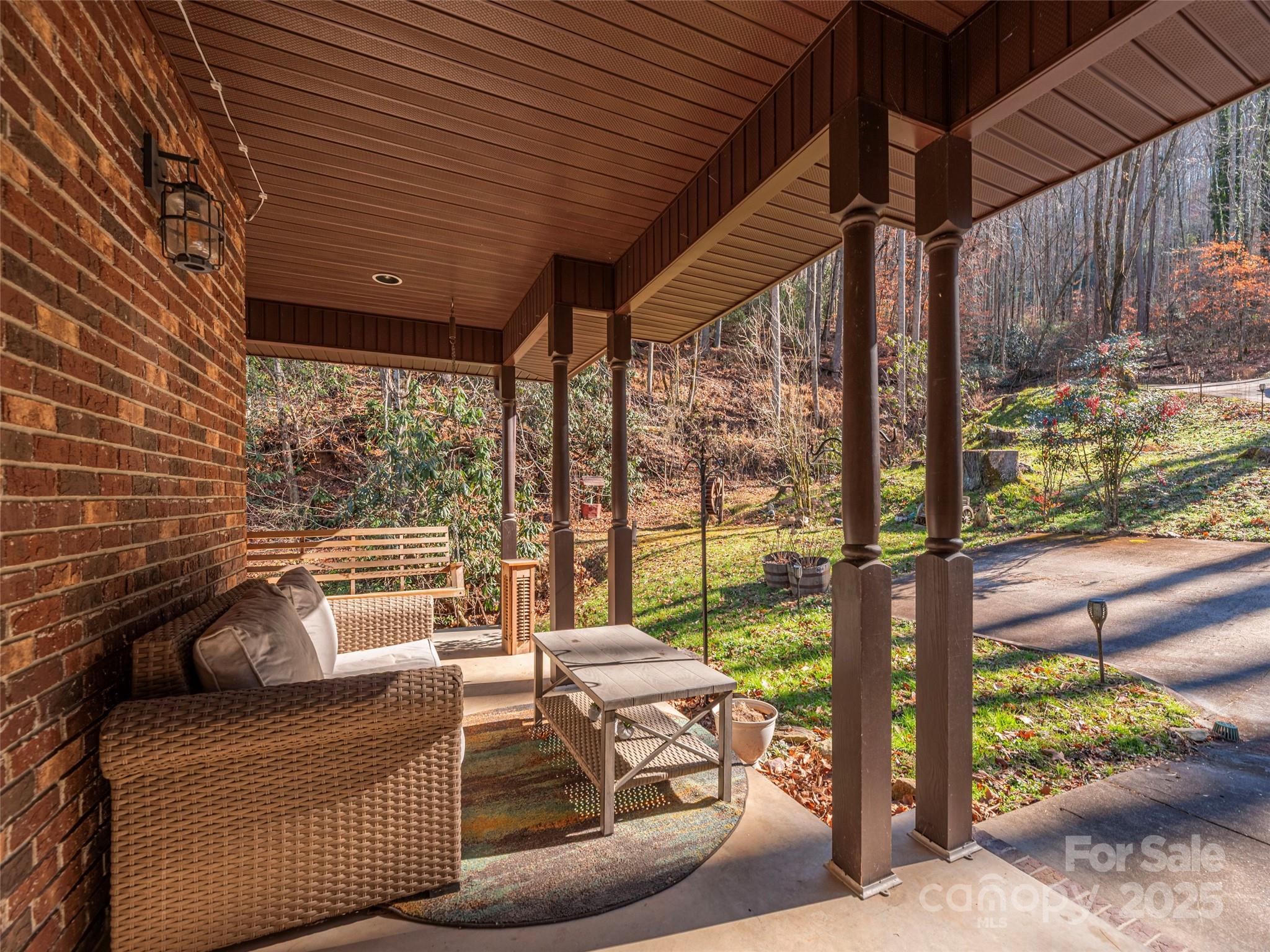 187 Turtle Creek Road Sylva, NC 28779 - Photo 3 of 36 a view of a patio with a table and chairs