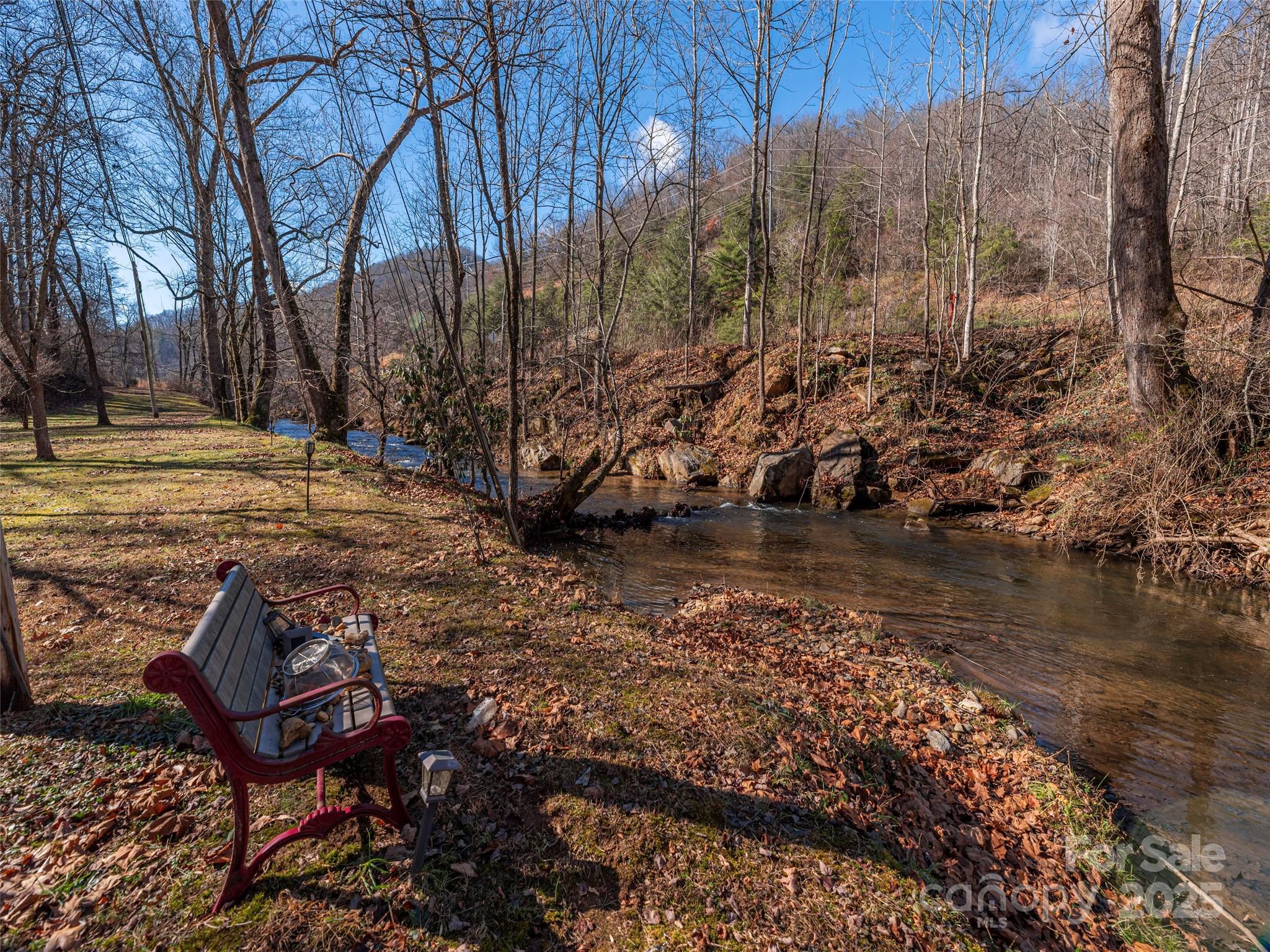 187 Turtle Creek Road Sylva, NC 28779 - Photo 31 of 36 a view of a lake with outdoor seating