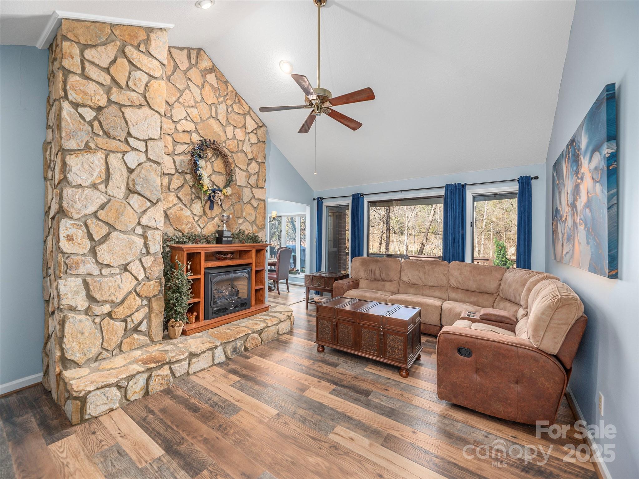 187 Turtle Creek Road Sylva, NC 28779 - Photo 5 of 36 a living room with furniture and a fireplace