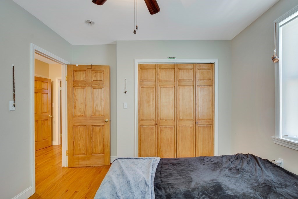 35 Madison Street Malden, MA 02148 - Photo 5 of 9 a bedroom with a bed and a window