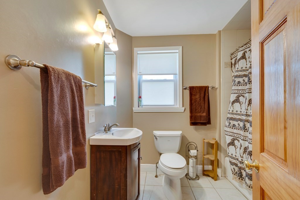 35 Madison Street Malden, MA 02148 - Photo 6 of 9 a bathroom with a toilet sink and shower