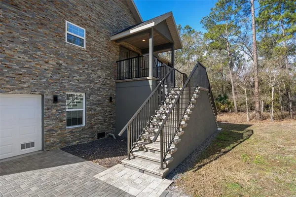 a view of empty room with a fireplace