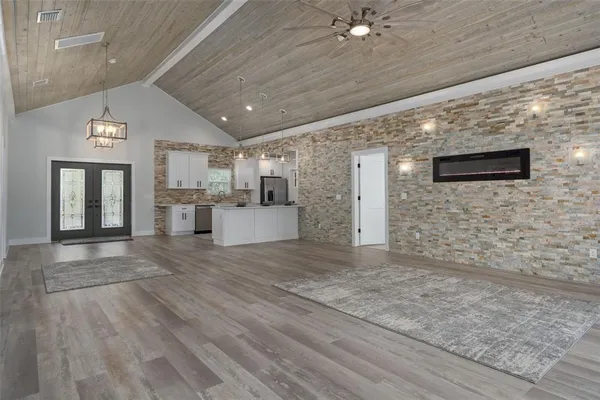 a spacious bathroom with a sink and a mirror