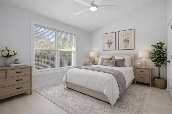 a bedroom with a bed and a couch