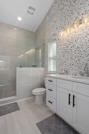 a view of a livingroom with a furniture cabinets and a ceiling fan
